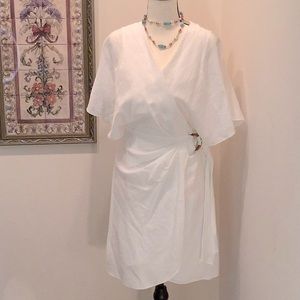 Lucy Paris Size small. White crepe like lined. true wrap dress.
